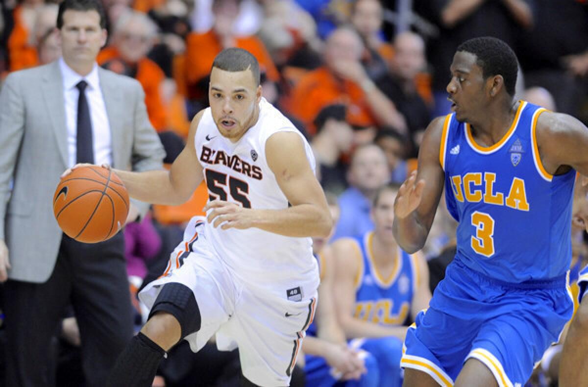 Oregon State guard Roberto Nelson, the leading scorer in the Pac-12 Conference, drives against UCLA guard Jordan Adams during a game earlier this season in Corvallis.