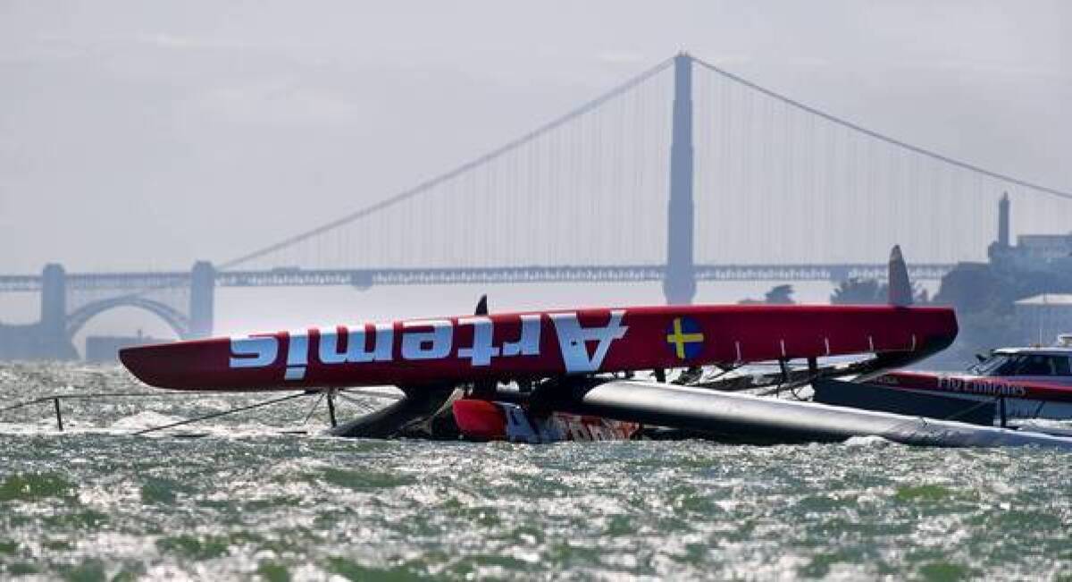 The Artemis Racing AC72 catamaran, an America's Cup entry from Sweden, lies capsized in San Francisco Bay on Thursday. Andrew "Bart" Simpson, an Olympic gold medalist from Great Britain, died after the capsized boat's platform trapped him underwater for about 15 minutes.