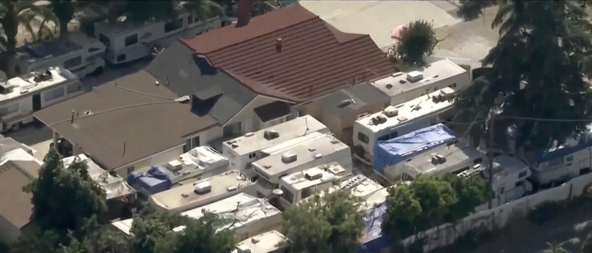 Aerial view of several RVs parked in a neighborhood.