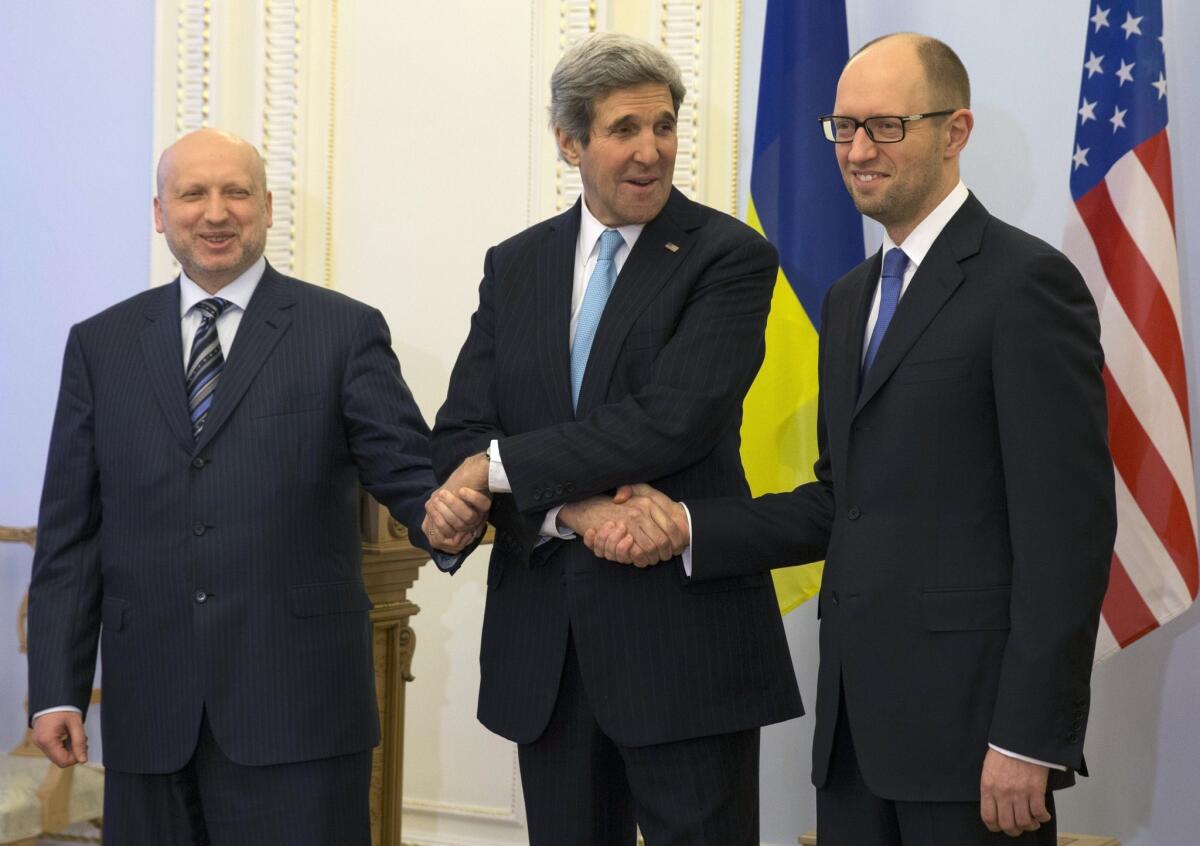 Ukraine's interim president, Oleksandr Turchynov, left, with Secretary of State John F. Kerry and interim Prime Minister Arseniy Yatsenyuk at a meeting in Kiev on Tuesday.