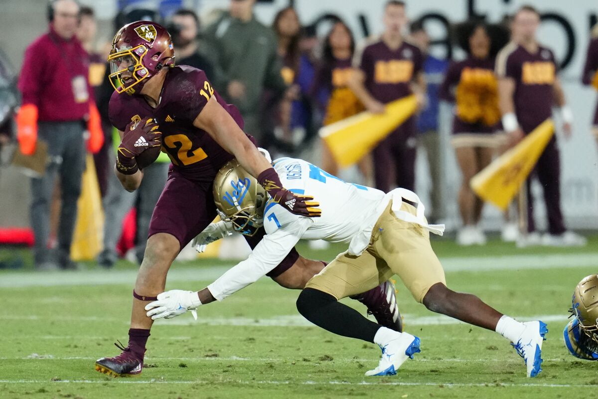 UCLA's Mo Osling III tackles an Arizona State player.