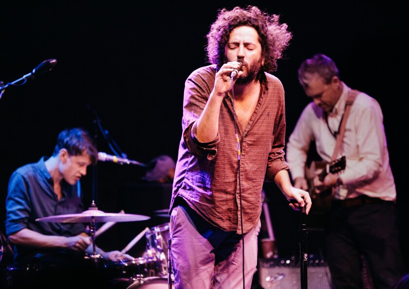 Destroyer front man Dan Bejar, second from left, on stage at the Regent Theater on Sunday night.