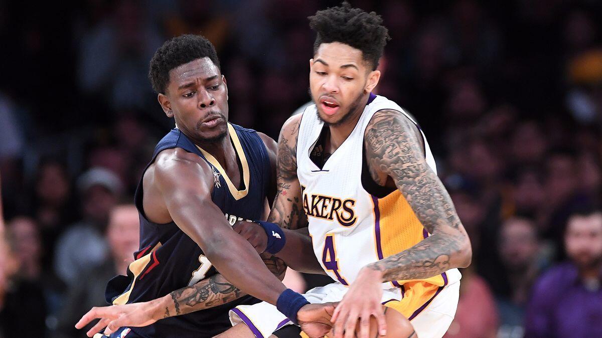 Lakers' Brandon Ingram has the ball stolen by New Orleans Pelicans Jrue Holiday late in the fourth quarter at the Staples Center Sunday.
