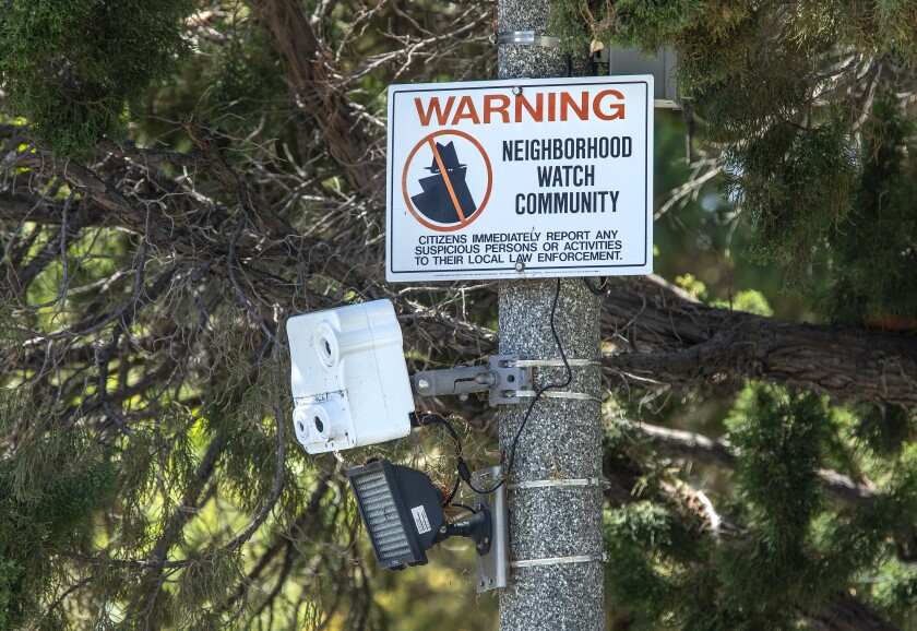 A security camera on a pole at the intersection of Gregory Way and Oakhurst Drive.