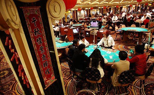 Pai gow poker is the game of choice at table at right in Caesars. Players hope the Year of the Ox, which began Jan. 26 and is marked by red lanterns in the table-game area, will be a lucky one for them.