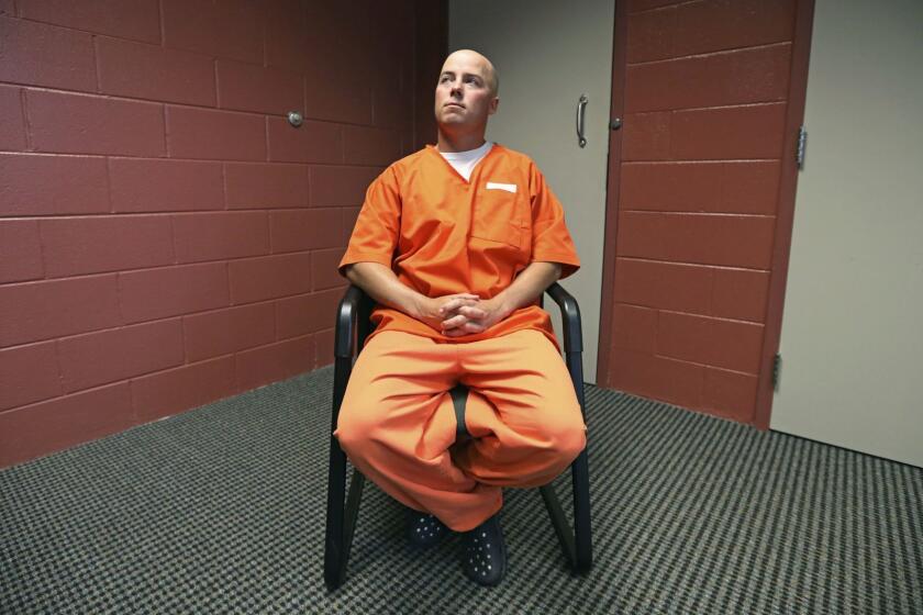In this Tuesday, Oct. 9, 2018, photo, inmate Russell Henderson looks on during a prison interview at Wyoming Medium Correctional Institution, in Torrington, Wyo. Henderson is serving two consecutive life sentences for the murder of Matthew Shepard. Disagreement and raw emotion over Shepard's killing linger in Wyoming 20 years after the crime. (AP Photo/Rick Bowmer)