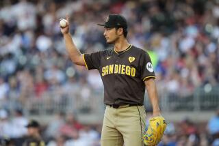 San Diego Padres pitcher Yu Darvish (11) works in the second inning of a baseball game against the Atlanta Braves, Sunday, May 19, 2024, in Atlanta. (AP Photo/Mike Stewart)