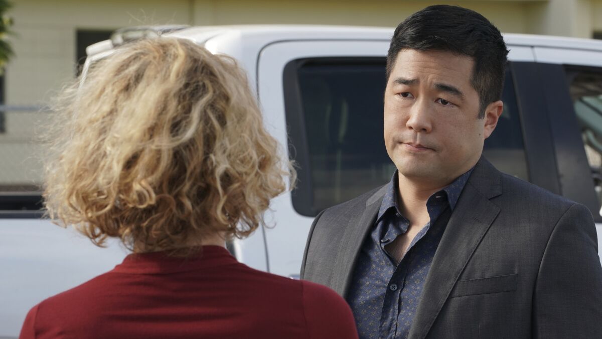 Perdita Weeks and Tim Kang in "Magnum P.I." on CBS.