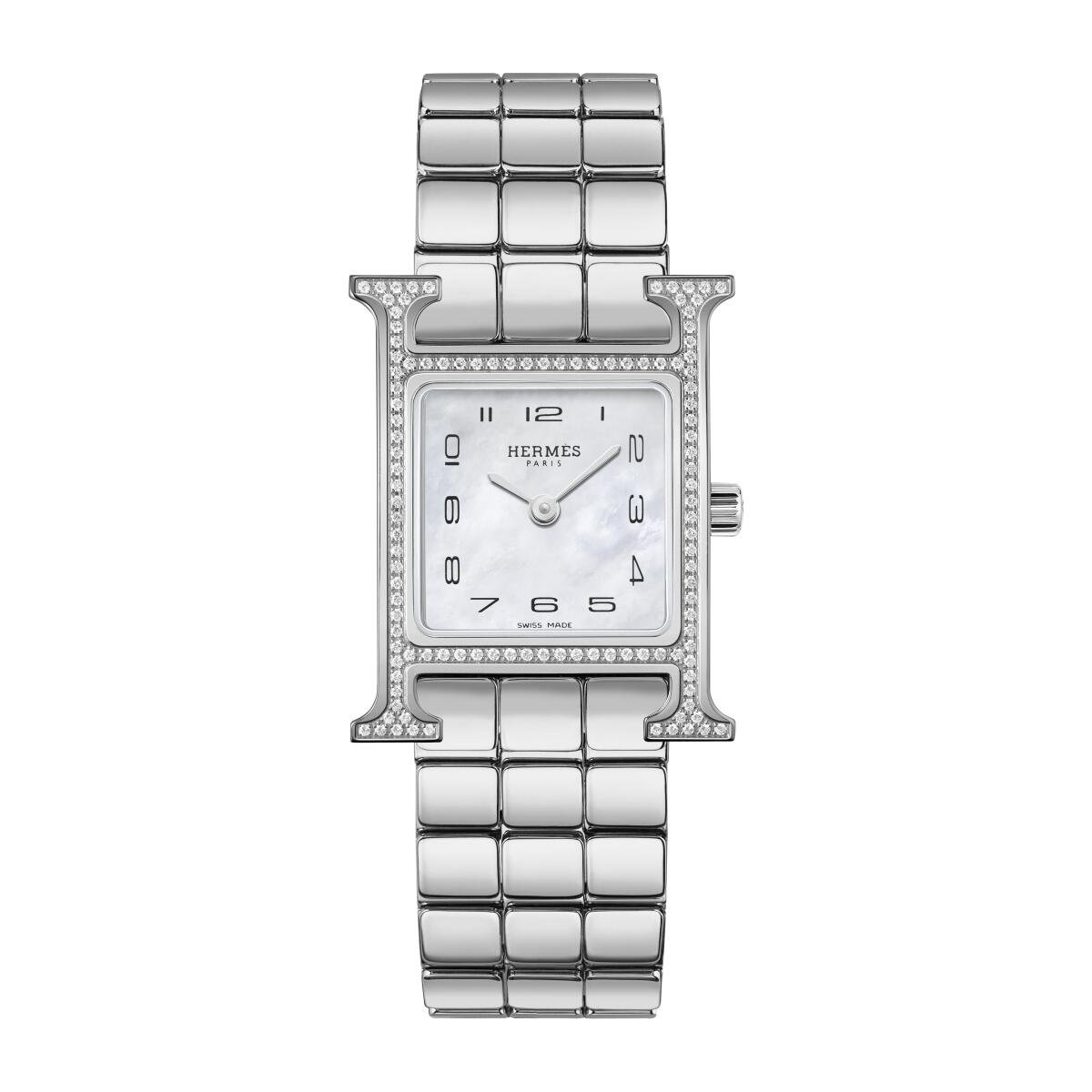 A photo of the Hermès Heure H steel watch with 114 feather-set diamonds and a natural white mother-of-pearl dial