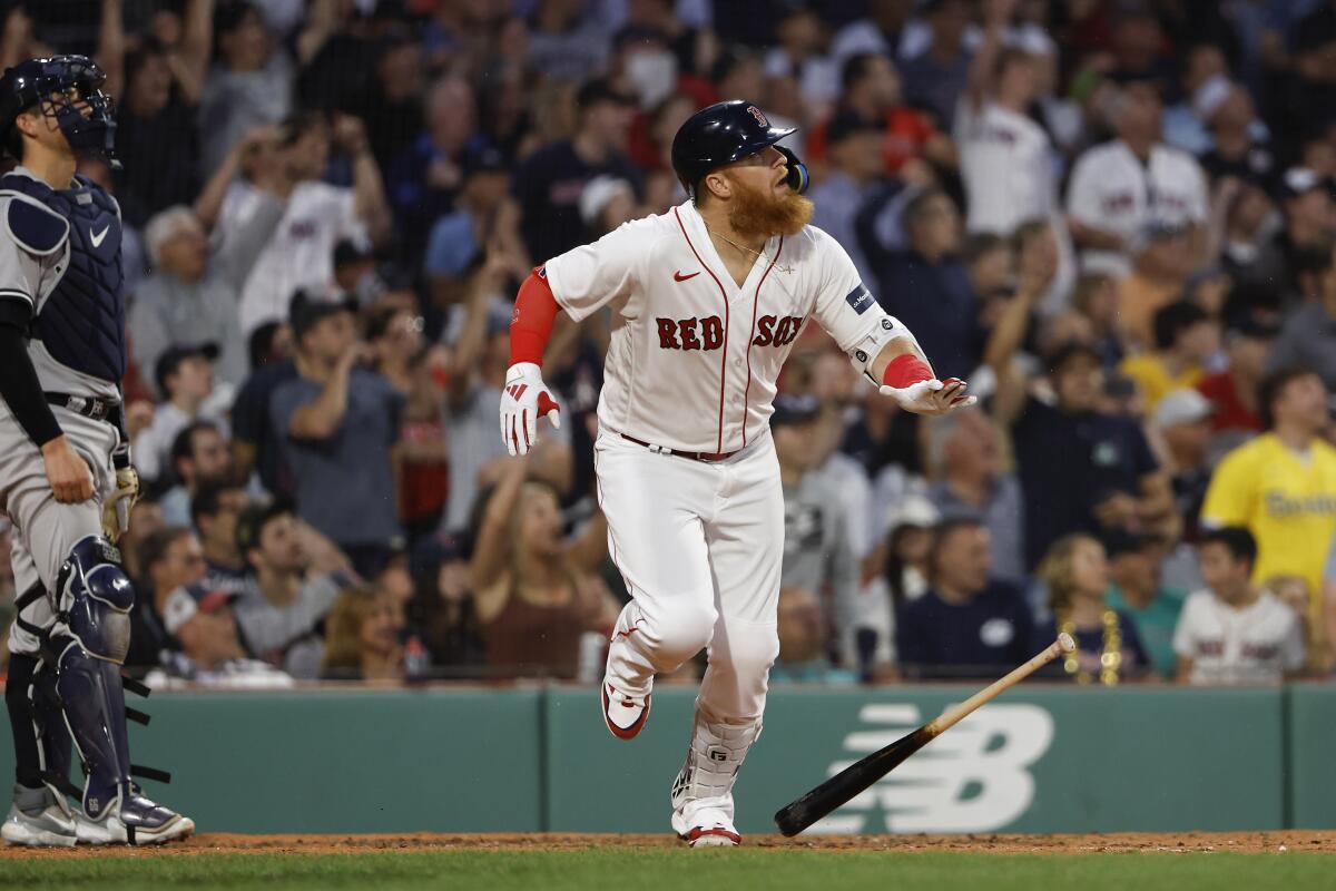 Boston Red Sox SS Pablos Reyes celebrates his walk-off grand slam