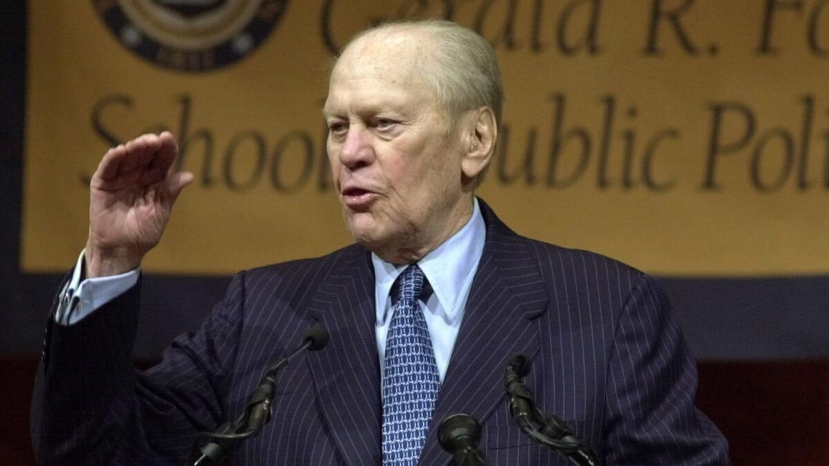 Former President Gerald Ford speaks at the University of Michigan in Ann Arbor, Mich., Thursday, Sept. 18, 2003 at a dedication of the future site of the Gerald R. Ford School of Public Policy. Ford recalled how his education at the university seven decades ago gave him a foundation for a political career that eventually led to the White House. (AP Photo/Carlos Osorio)