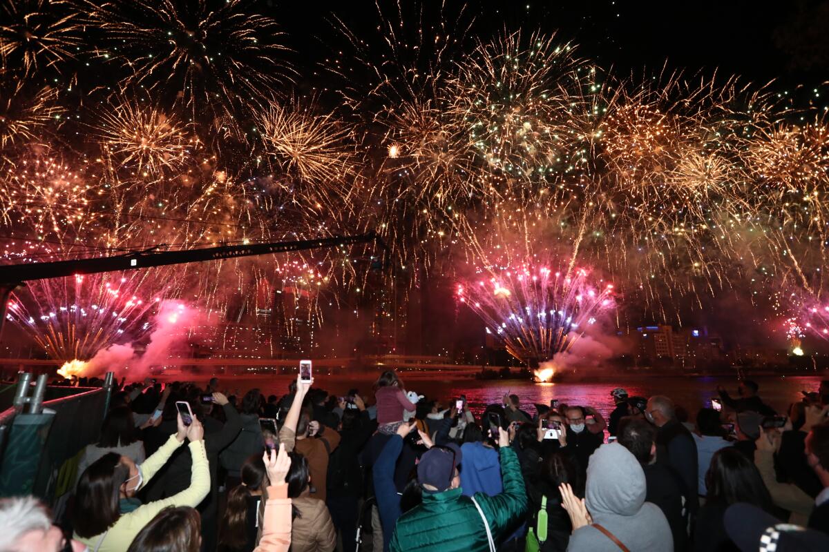 People celebrate in Brisbane, Australia, after the IOC selected the city to host the 2032 Summer Olympics.