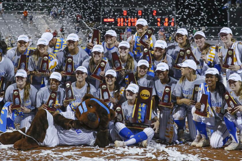 The UCLA softball team poses for a photo after defeating Oklahoma to win the NCAA title June 4, 2019.