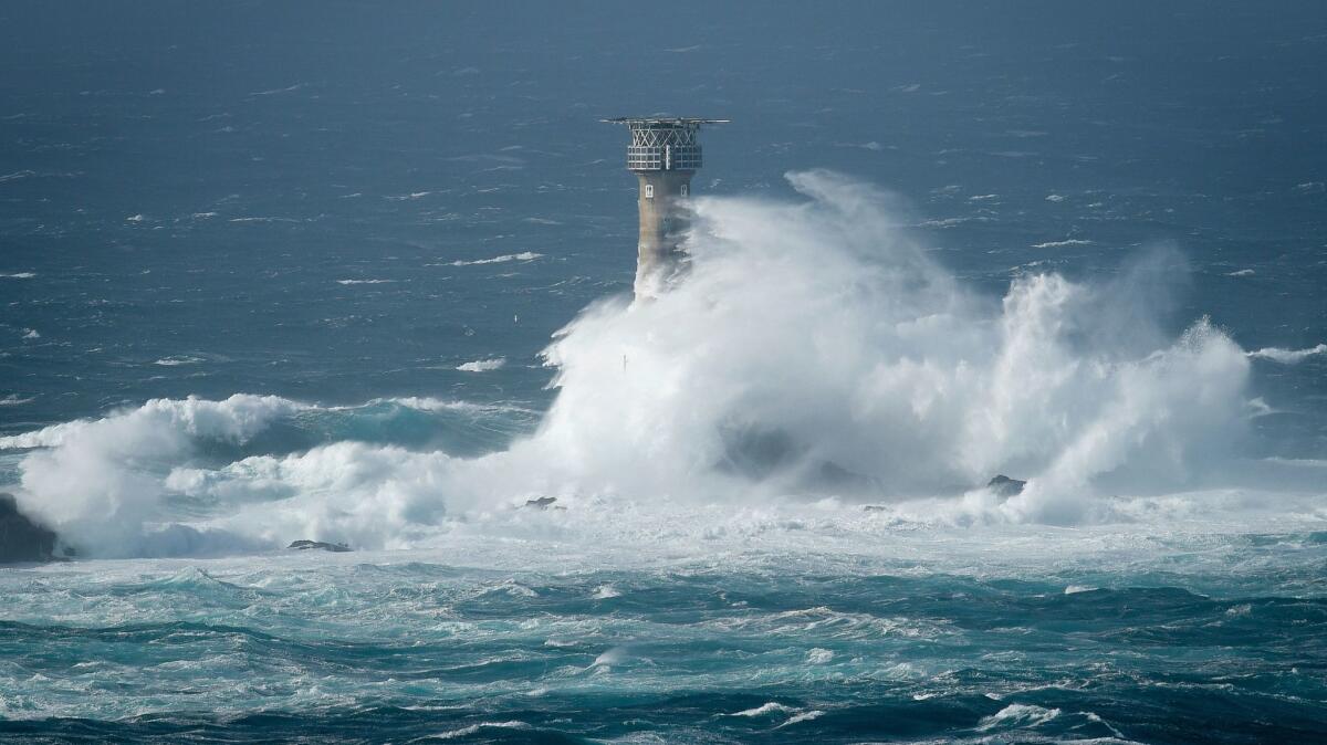 Waves break on Longships lighthouse off the coast of Lands End in southwestern England, as the remnants of Hurricane Ophelia hit parts of Britain and Ireland on Oct. 16.