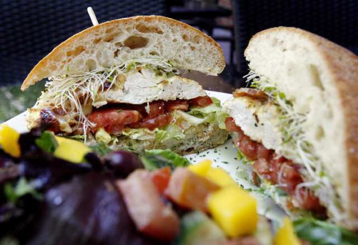 The Chicken Club, of roast chicken with smoked Applewood bacon, tomatoes, lettuce, sprouts and mayo on a toasted ciabatta at Wild Carvery, on the corner of Olive Avenue and San Fernando Boulevard in Burbank, opened five weeks ago and serves natural meats and organic produce for sandwiches, salads, coffee and shakes.