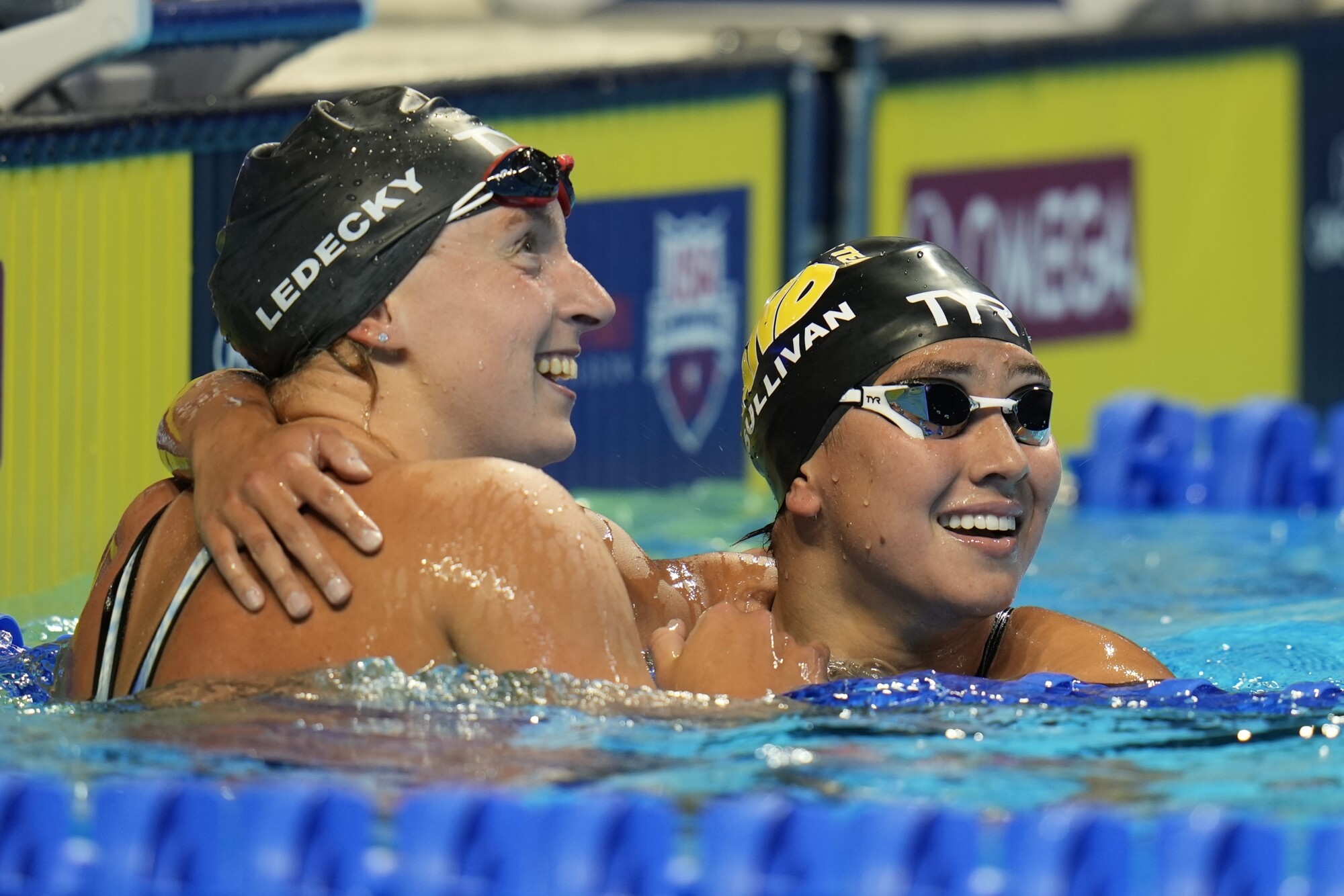 Katie Ledecky hugs Erica Sullivan after winning the women's 1500 freestyle
