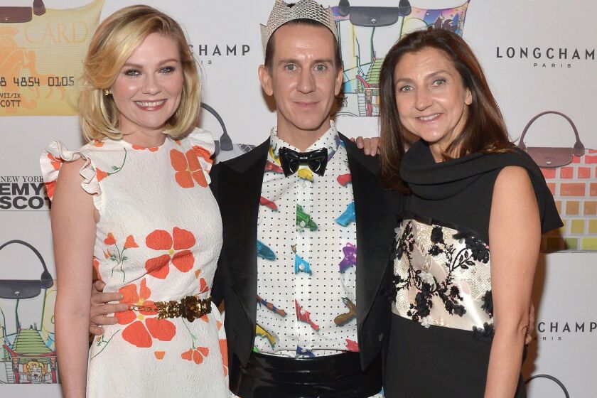 From left: Kirsten Dunst, designer Jeremy Scott and Longchamp Artistic Director Sophie Delafontaine attend the Jeremy Scott for Longchamp 10th Anniversary on Nov. 5.
