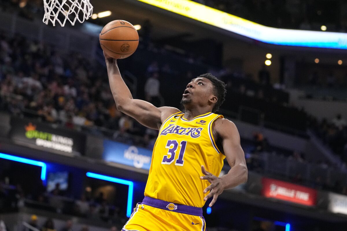 Los Angeles Lakers center Thomas Bryant (31) goes up for a dunk against the Indiana Pacers during the first half of an NBA basketball game in Indianapolis, Thursday, Feb. 2, 2023. (AP Photo/Michael Conroy)