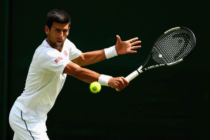 Novak Djokovic works on his game during a practice session at the All England Lawn Tennis and Croquet Club on Saturday at Wimbledon.