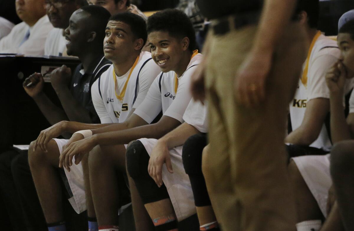Bishop Montgomery brothers Stevie Thompson,left, and younger brother Ethan take a breather during a game.