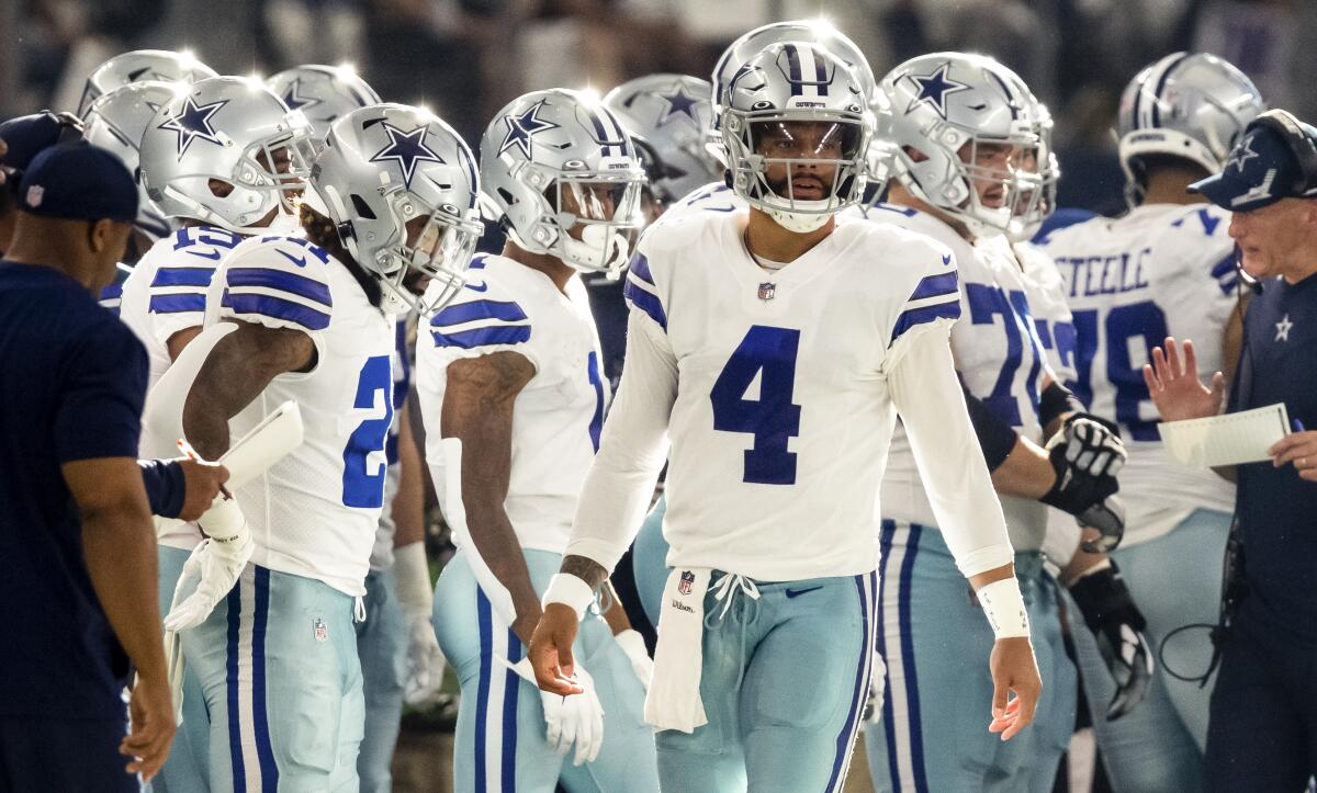 Dallas Cowboys quarterback Dak Prescott looks on from the sideline during Sunday's win over the Giants.