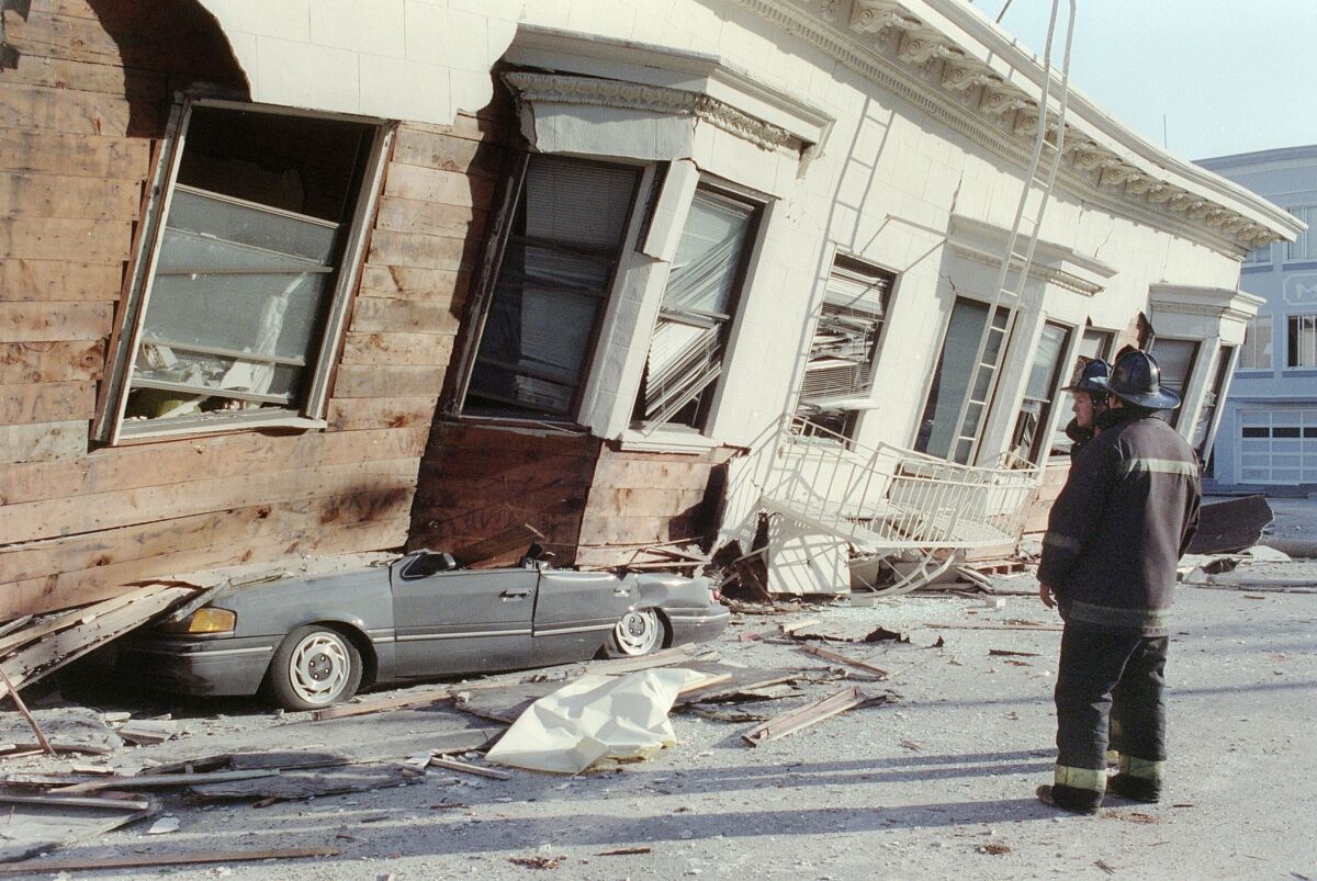 A building crushed a car in San Francisco's Marina District in the 1989 Loma Prieta earthquake.