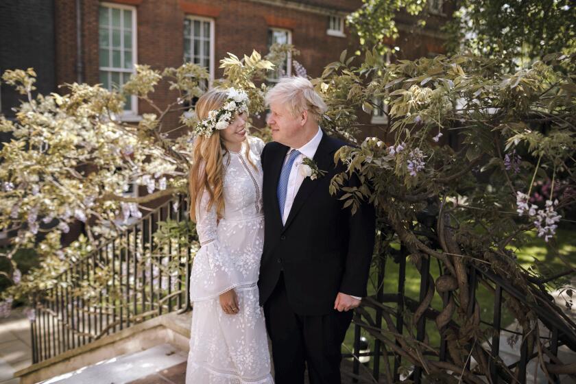 British Prime Minister Boris Johnson and Carrie Johnson after their wedding on Saturday.