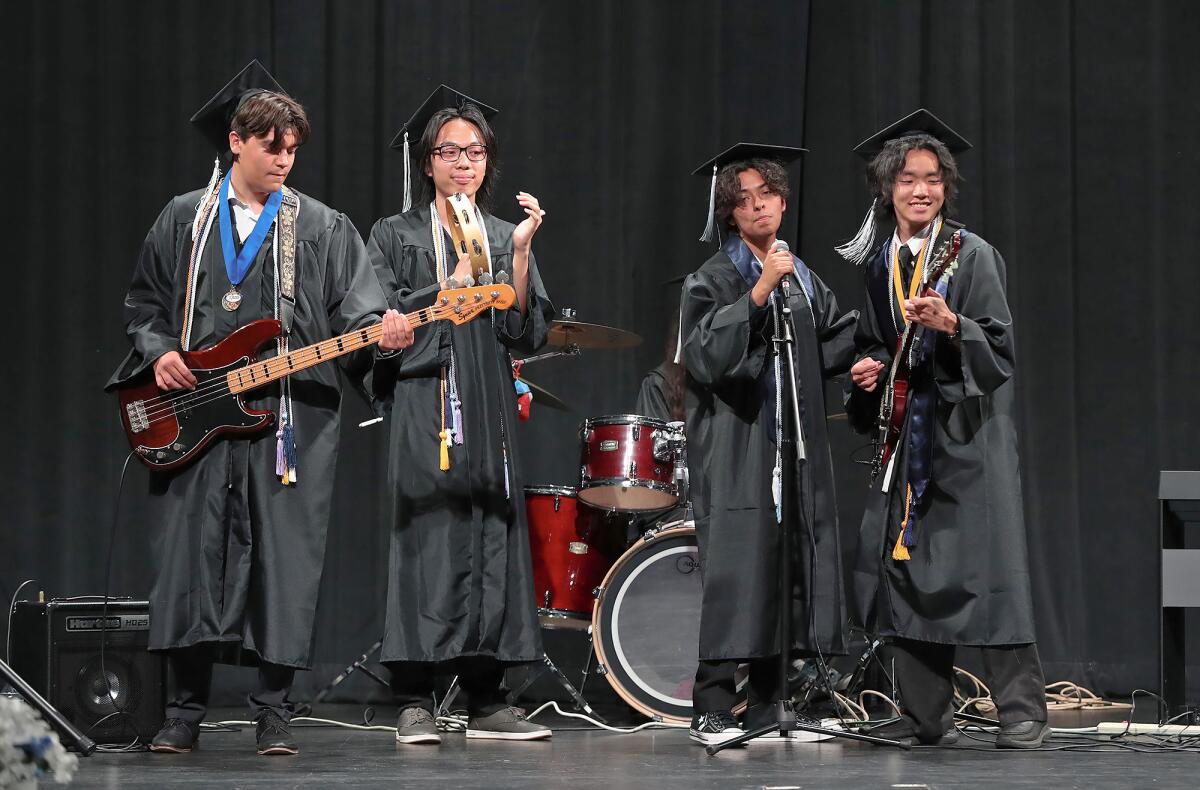 Victor Jimenez, Noah Tran, Oliver Alvarado and Toby Nguyen, from left, perform at Early College High School's graduation.