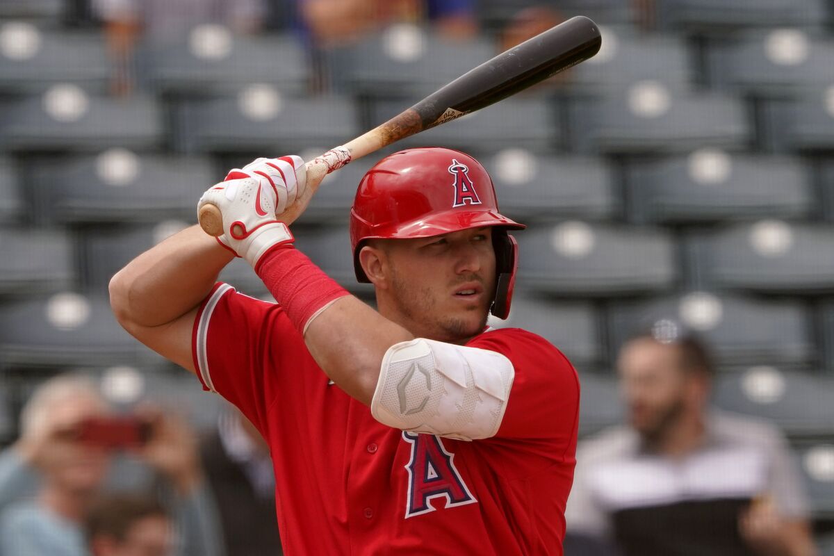 Angels center fielder Mike Trout bats against the Oakland Athletics in a spring training game on March 28.