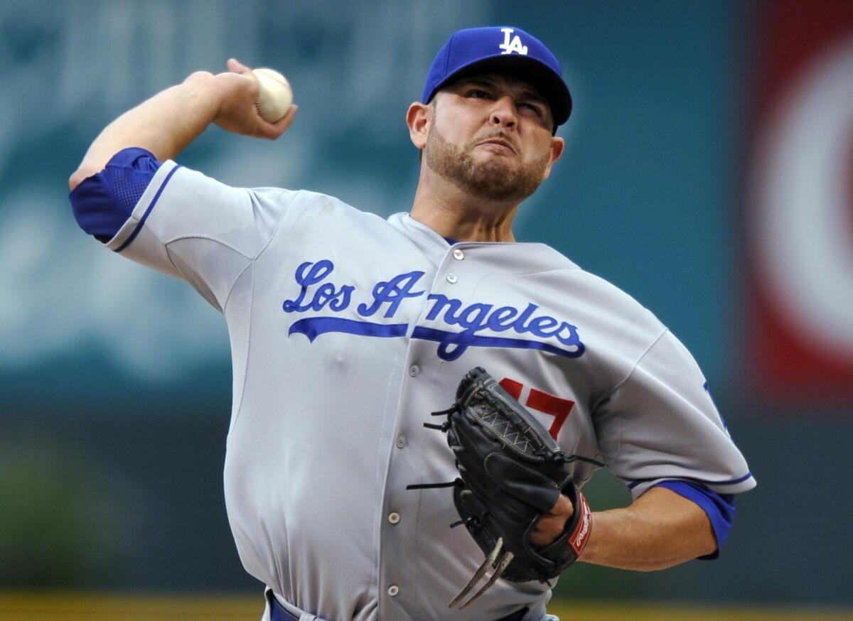 Dodgers starter Ricky Nolasco delivers a pitch during the first inning of Tuesday's game against the Colorado Rockies.