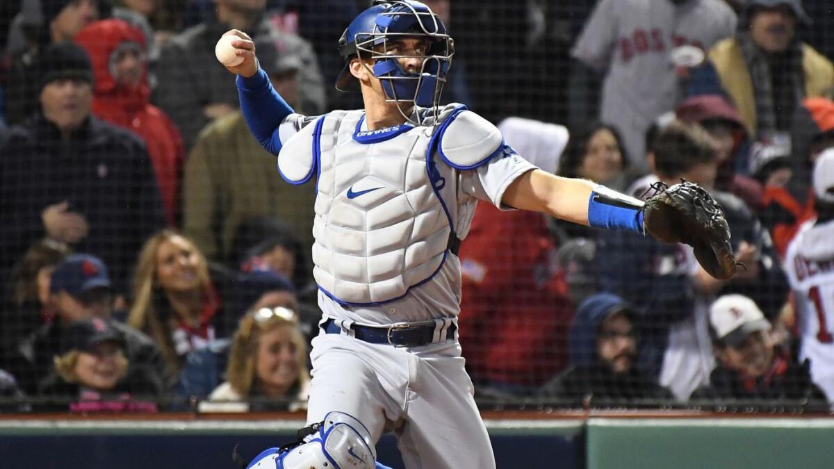 Dodgers catcher Austin Barnes throws in the sixth inning of Game 1 of the World Series at Fenway Park in Boston on Oct. 23.