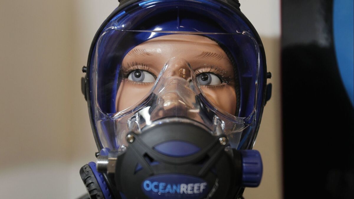 Ocean Reef G.divers full face scuba diving mask, is displayed on a mannequin at the Ocean Reef headquarters in San Marcos on Wednesday. It's the type of mask that Ocean Reef's parent company in Italy sent to the Thai cave rescue effort.