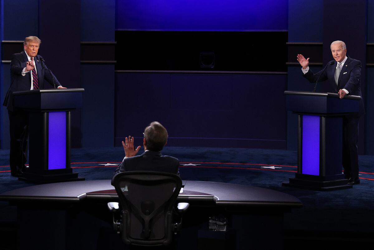 Then-President Trump and Democratic nominee Joe Biden speak at their only debate before the election on Sept. 29, 2020. 