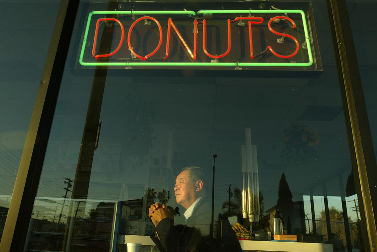 Ted Ngoy sits inside a Christy's Donut Shop, which he built in the mid-1980s, in Hawthorne in 2004.