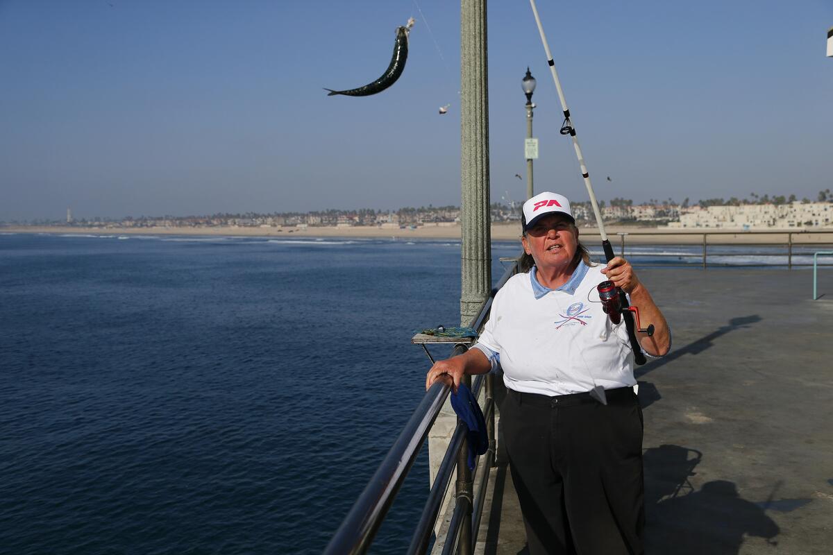 Blair Brooks of Huntington Beach pulls up a mackerel.