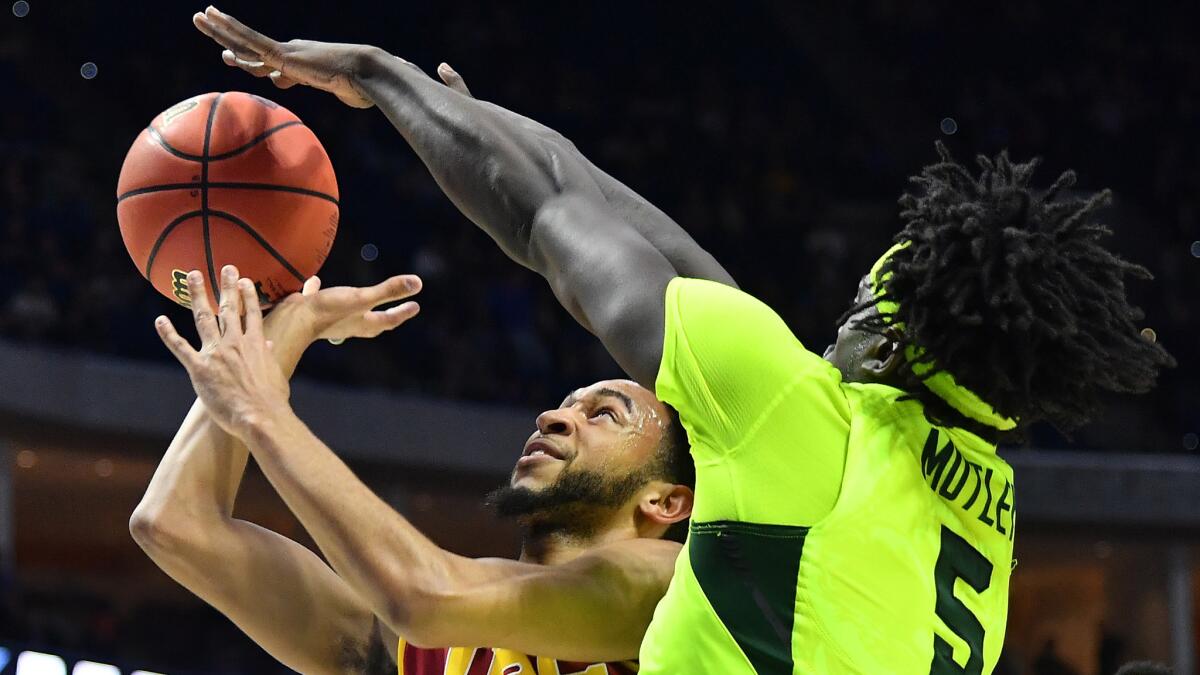 Baylor forward Johnathan Motley tries to block a layup by USC point guard Jordan McLaughlin during the first half Sunday.