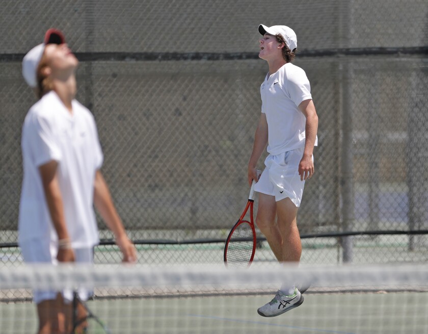 Corona del Mar's Niels Hoffmann, left, reacts to the loss of a close point with doubles partner Jack Cross on Thursday.