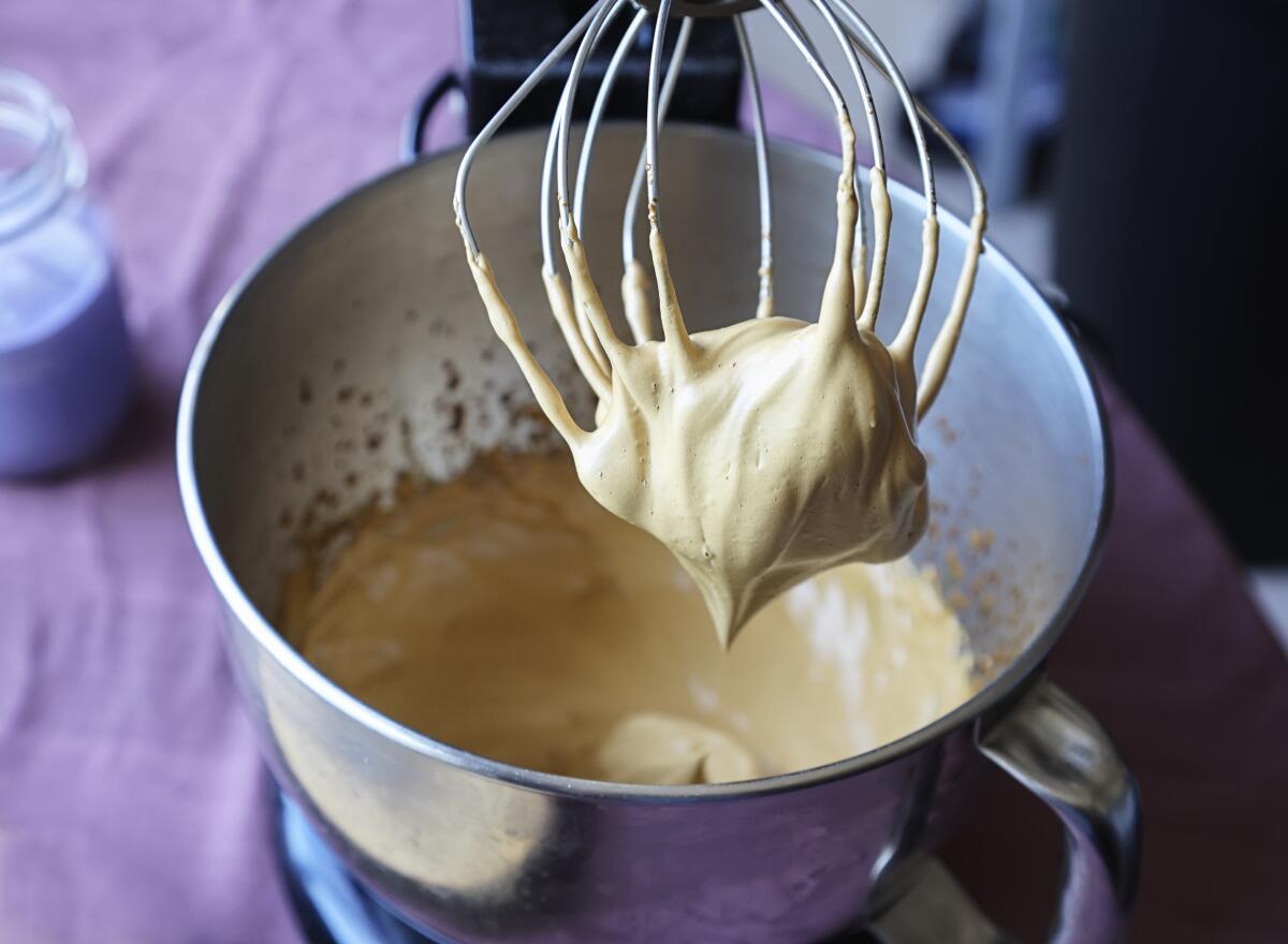 Combine instant coffee, sugar and hot water in a mixing bowl and beat for 4 minutes or until stiff peaks form.