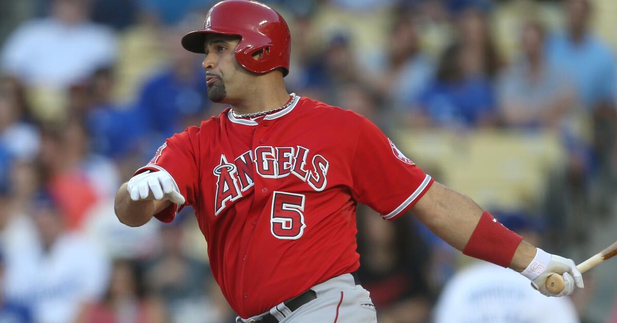 Major League Baseball player Albert Pujols and his daughter arrive