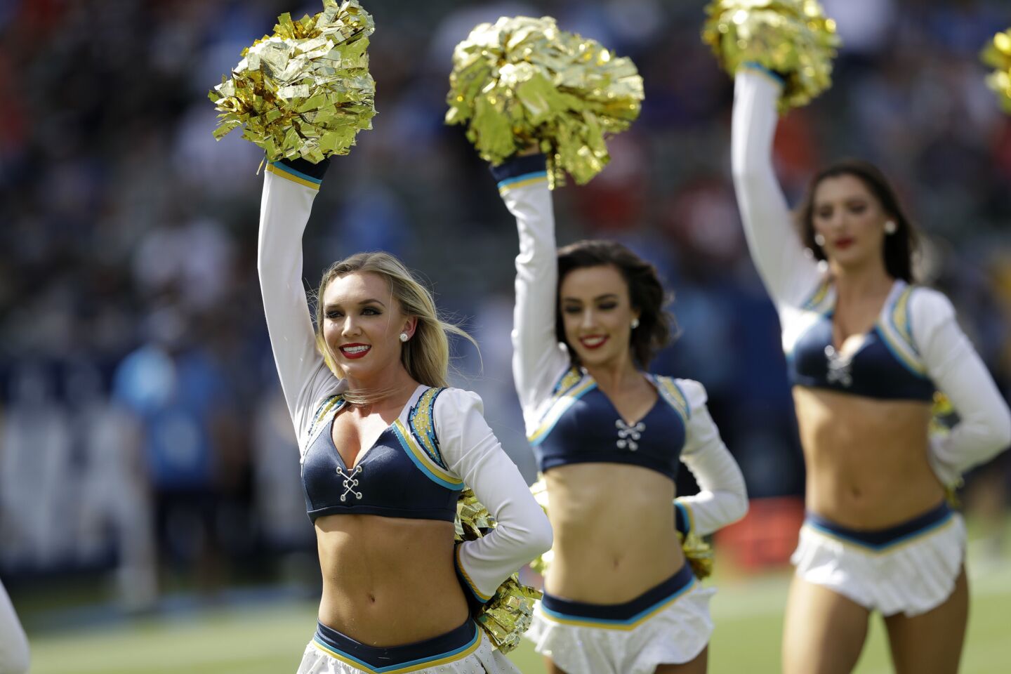 The Charger Girls take the field prior to an NFL football game between the Los Angeles Chargers and the San Francisco 49ers, Sunday, Sept. 30, 2018, in Carson, Calif.
