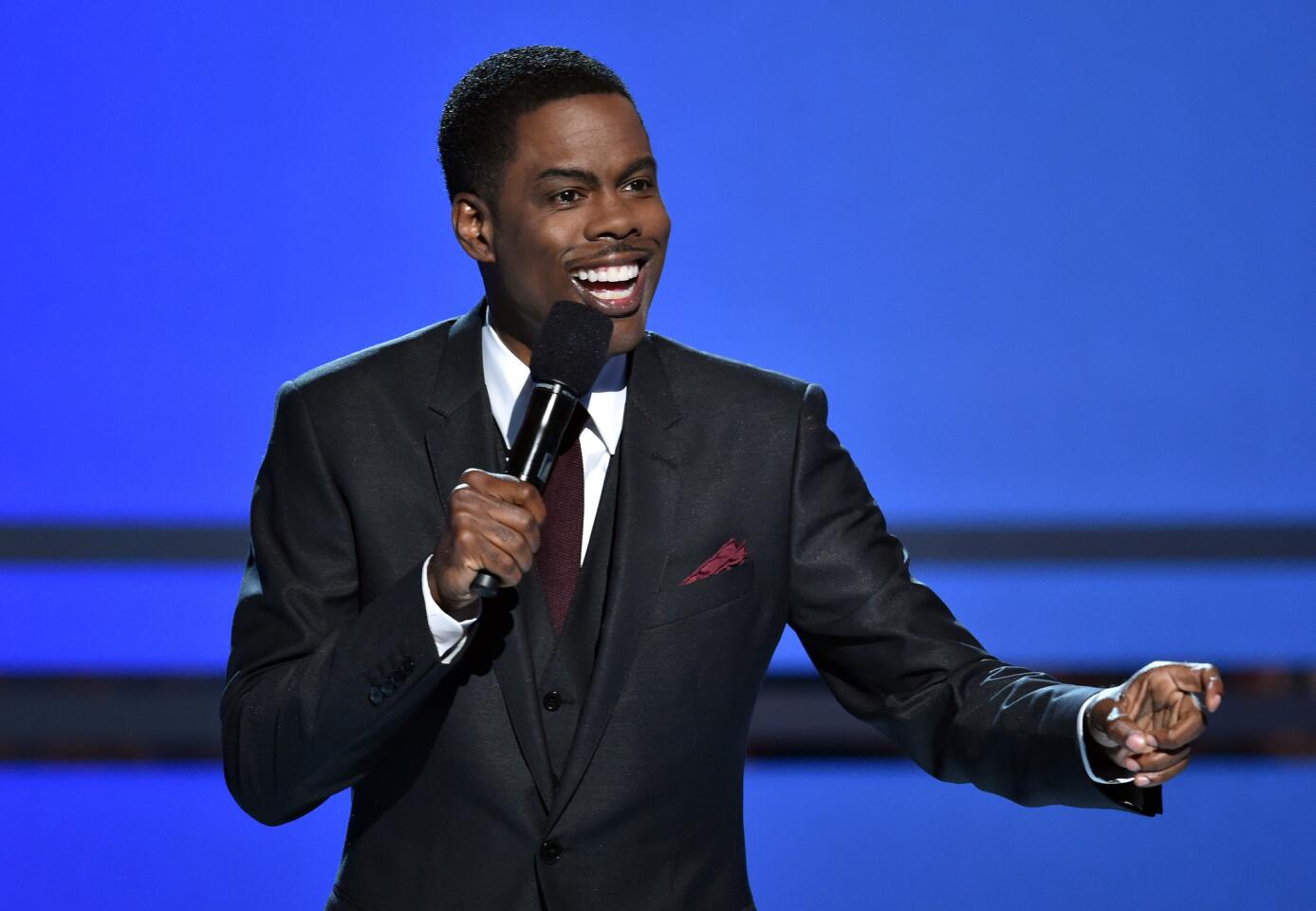 Host Chris Rock goes through his introduction onstage Sunday during the 2014 BET Awards at Nokia Theatre L.A. Live in Los Angeles.