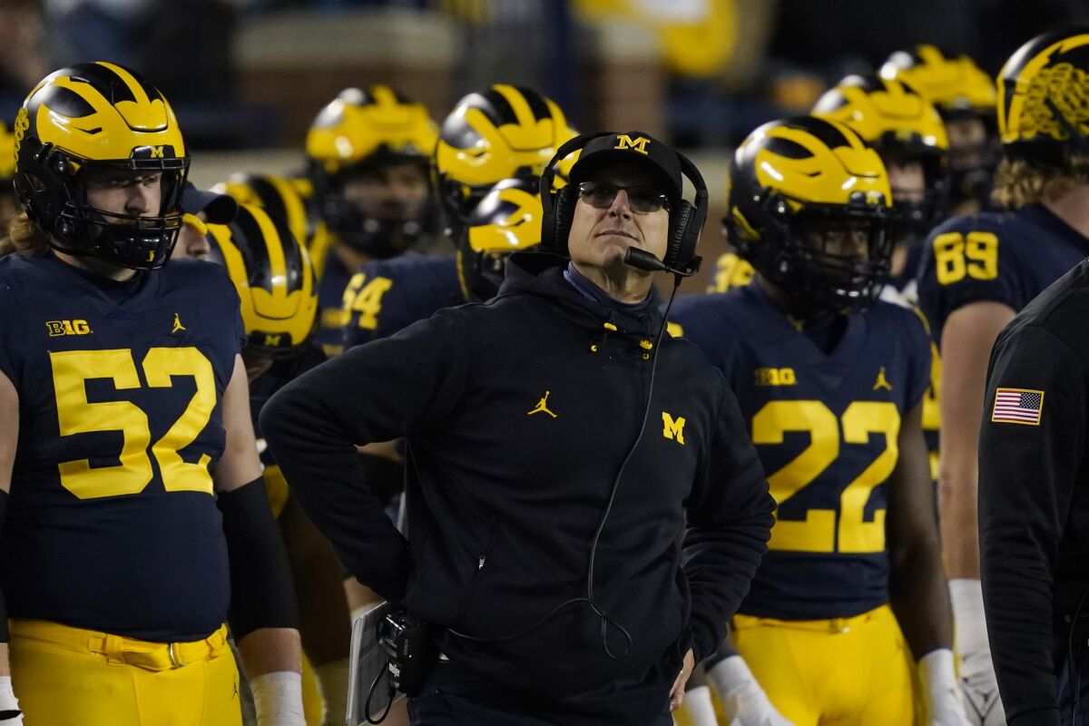 Michigan coach Jim Harbaugh watches the scoreboard during a win over Indiana on Nov. 6.