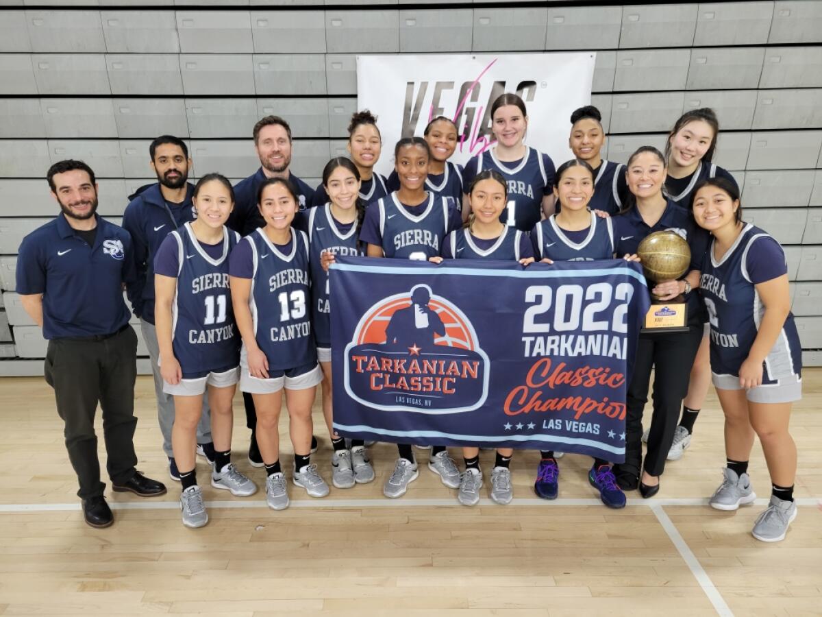 Sierra Canyon's unbeaten girls' basketball team celebrates winning its division of the Tarkanian Classic.