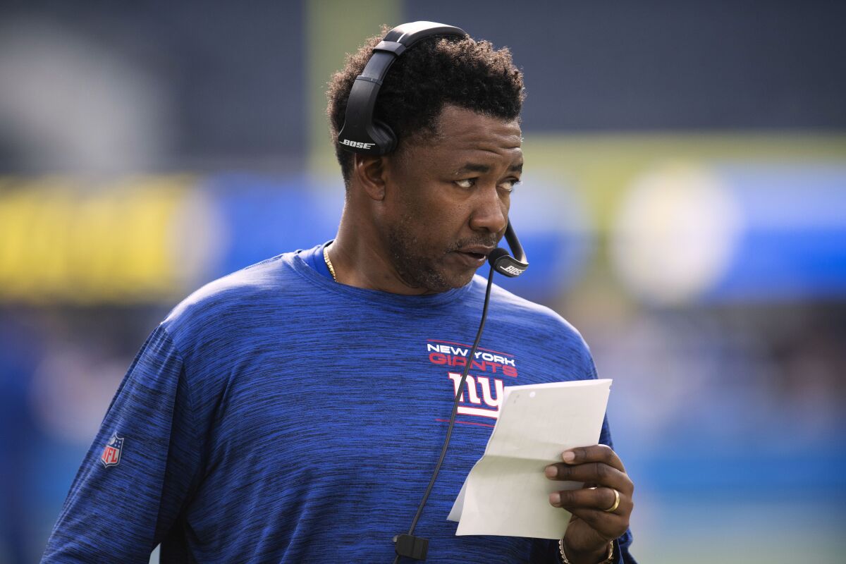 FILE - New York Giants defensive coordinator Patrick Graham stands on the field before the team's NFL football game against the Los Angeles Chargers on Dec. 12, 2021, in Inglewood, Calif. The Minnesota Vikings have entered a fast-paced final stretch of their head coach search. According to a person with knowledge of the process, New York Giants defensive coordinator Patrick Graham will interview at Vikings headquarters on Tuesday, Feb 1, 2022 followed by Michigan head coach Jim Harbaugh on Wednesday. (AP Photo/Kyusung Gong, File)