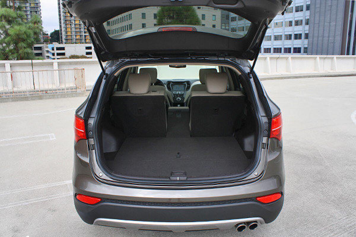 Inside the 2013 Hyundai Santa Se Sport are a number of clever tricks for storage and seating.