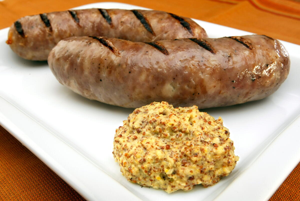 Hard cider mustard with two bratwurst