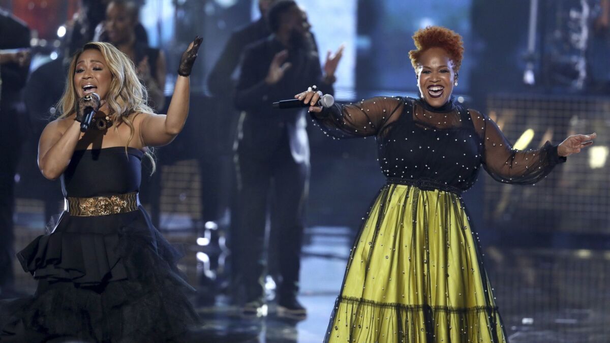 Erica Campbell, left, and Tina Campbell of Mary Mary perform during a tribute to the late Aretha Franklin at the American Music Awards.