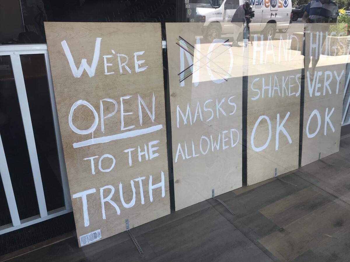Ramsay Devereux, owner of Ramsay One Construction, a Simi Valley flooring store, caused an online commotion when the anti-social distancing signs he put up two weeks ago were disseminated on social media. He shut the store after receiving threats.