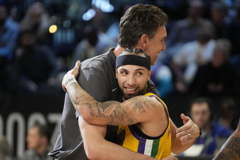 Pau Gasol, left, hugs Team Pau Gasol's Jose Alvarado, of the New Orleans Pelicans, after Alvarado made the game winning shot during an NBA Rising Stars final basketball game against Team Joakim Noah, Friday, Feb. 17, 2023, in Salt Lake City. (AP Photo/Rick Bowmer)