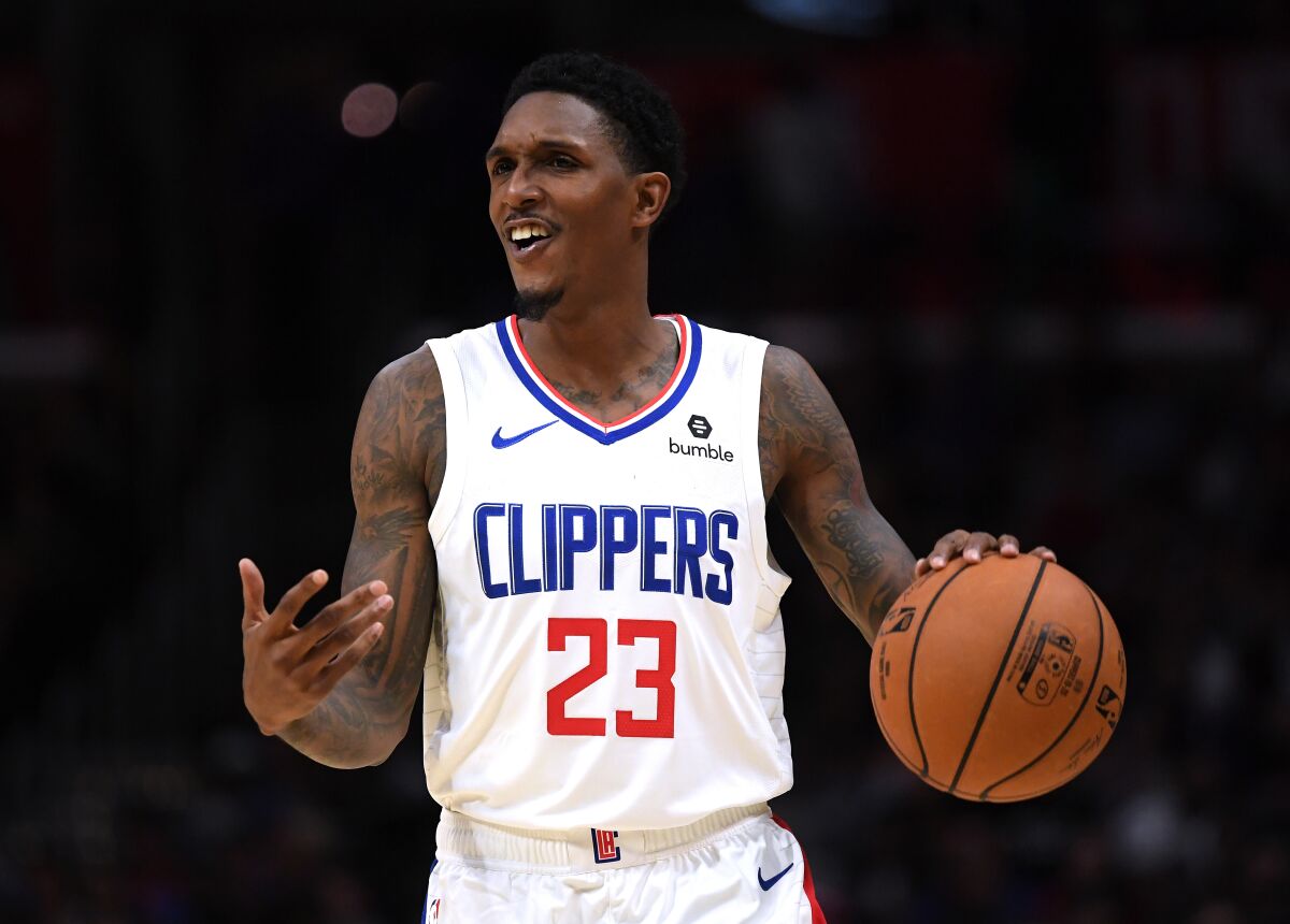 Clippers guard Lou Williams brings the ball up court during a preseason game against the Nuggets on Oct. 10, 2019.